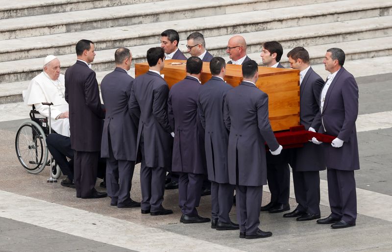 Supporters demand sainthood for Benedict as Pope Francis leads funeral