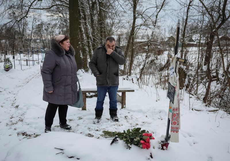 Friends, family mourn Bucha victim who became symbol of Ukraine's year-long war