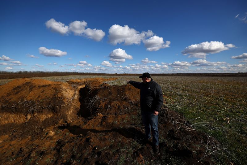 Analysis-Facing minefields and cash crunch, Ukraine farmers to sow smaller crop