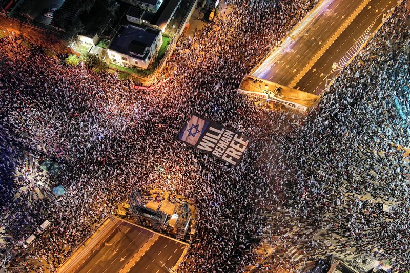 Israeli leaders rebuff Moody's outlook cut, protests persist