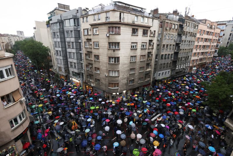 Tens of thousands in Serbia protest mass shootings, government policies