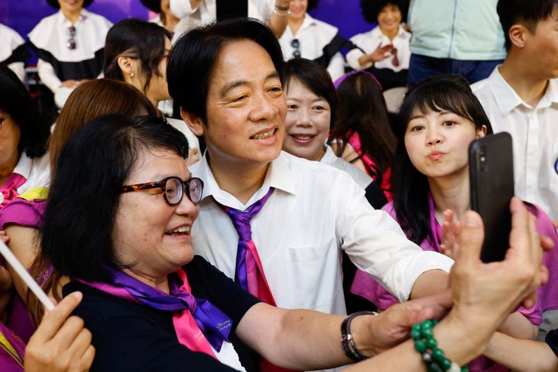 Taiwan ruling party pledges steady hand as opposition rallies