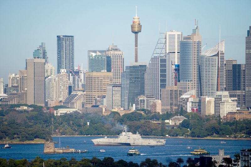 USS Canberra personnel parade in Australia capital amid joint war games