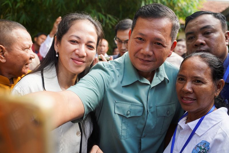 Cambodia PM's party claims landslide election win ahead of historic transition