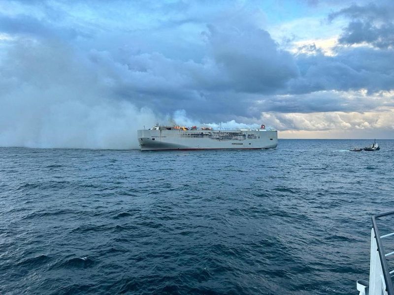 Car carrier still burning off Dutch coast as hunt for cause begins