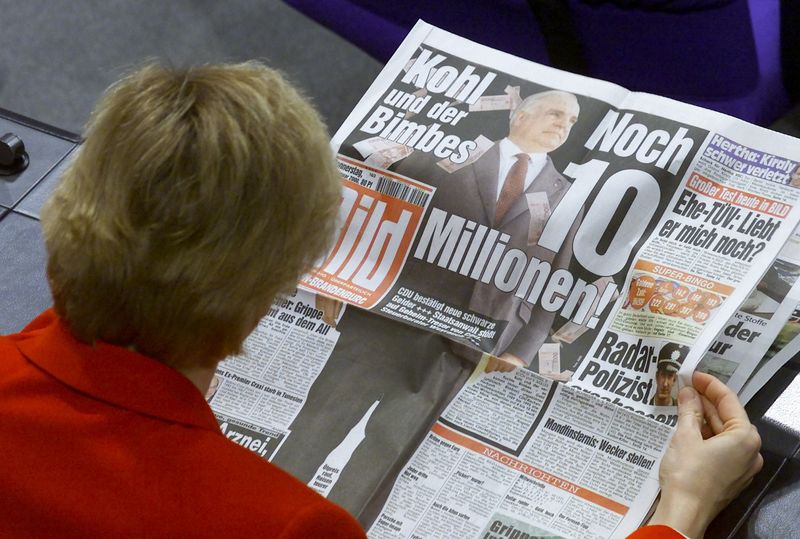 Germany's Axel Springer settles dispute with fired former Bild editor