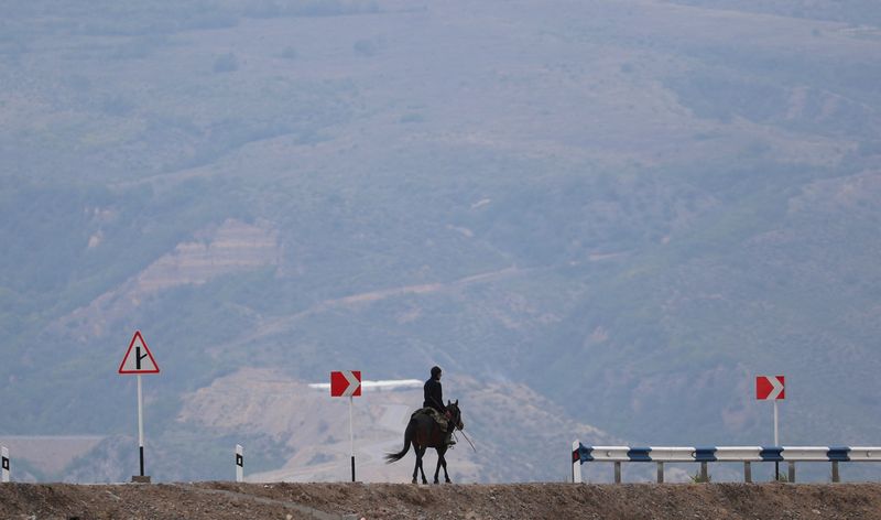 Karabakh Armenians say ceasefire being implemented, aid is arriving