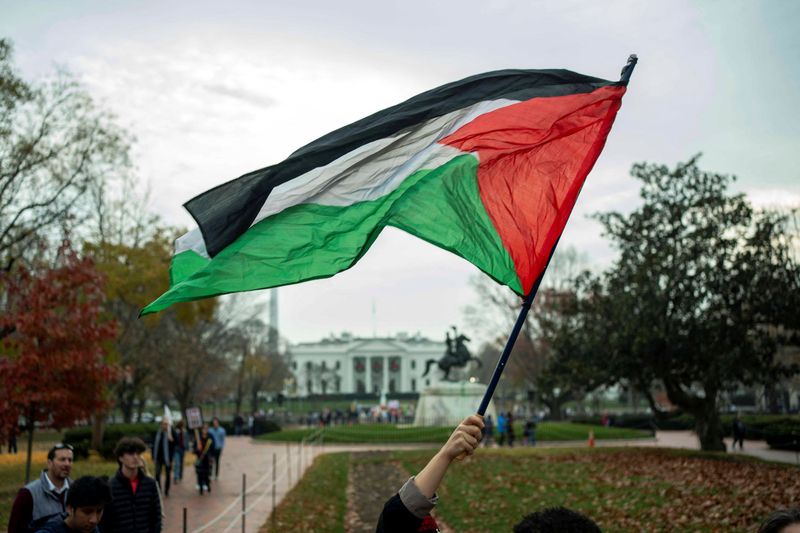 Hamas Supporters Hold Decapitated Head of President Biden
