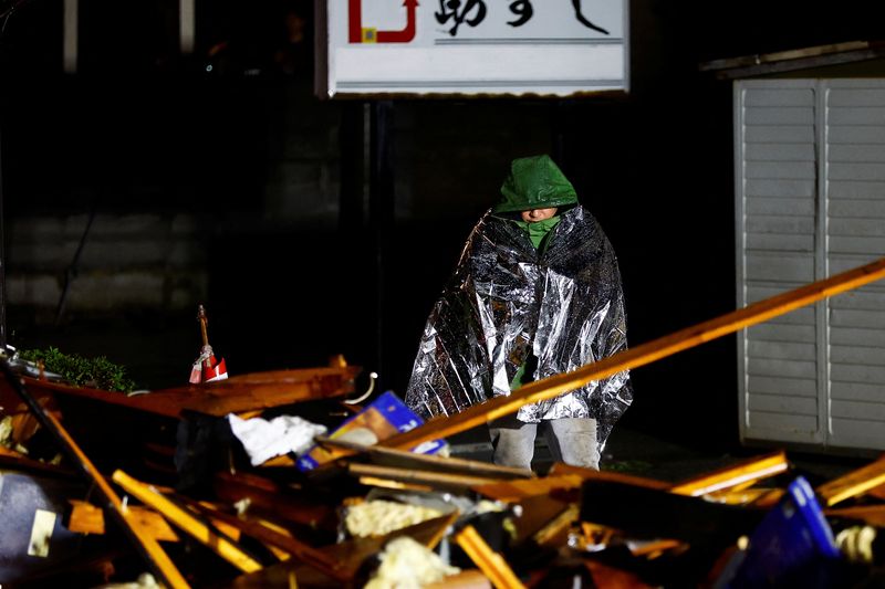 Japan quake survivors face freezing rain, threat of landslides