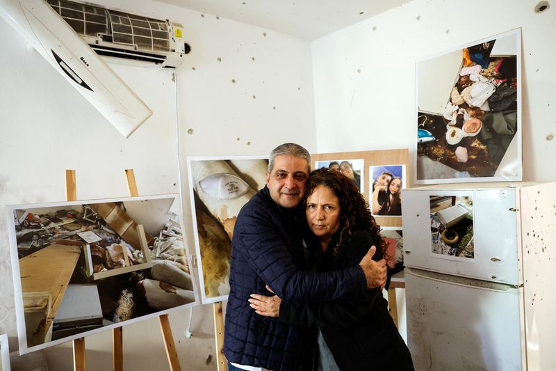 Israeli parents grieve in flat full of memories and bullet holes