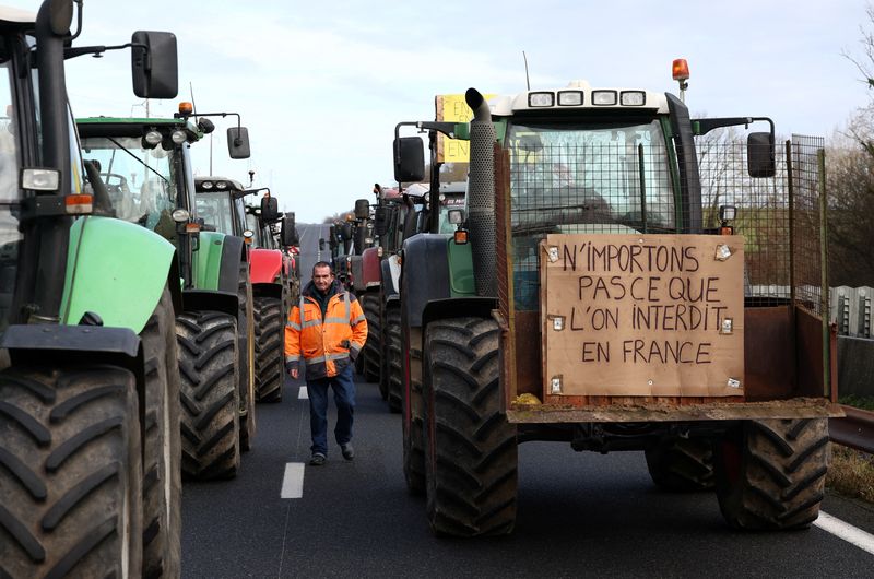 French farmers keep Paris roadblock threat as protests endure