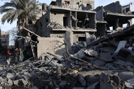 Israel frees two hostages, Palestinian TV says 74 killed in assault