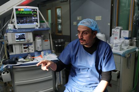 Palestinians describe terrifying and chaotic flight from Gaza hospital