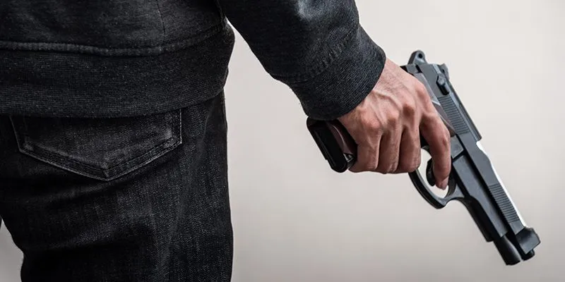 Cambridge man arrested after pointing guns at crowd Cambridge man arrested after pointing guns at crowd
