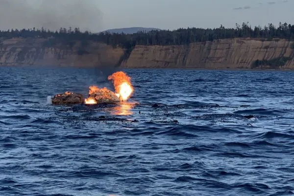 Three rescued from burning boat by Coast Guard Three rescued from burning boat by Coast Guard