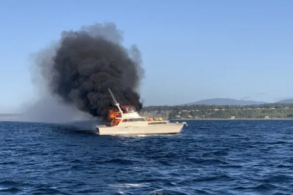 Three rescued from burning boat by Coast Guard Three rescued from burning boat by Coast Guard