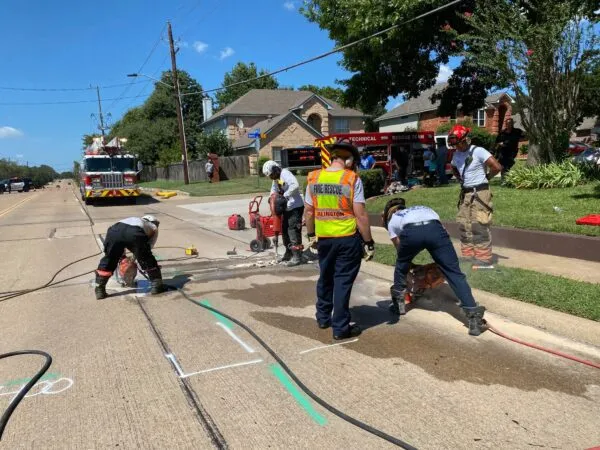 Rescuers dig up entire road to save dog stuck in storm drain Rescuers dig up entire road to save dog stuck in storm drain