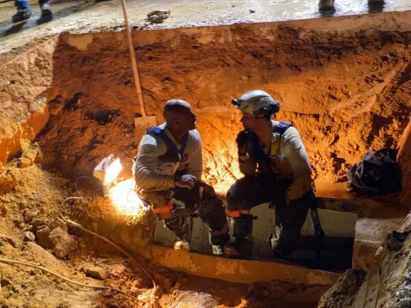 Rescuers dig up entire road to save dog stuck in storm drain Rescuers dig up entire road to save dog stuck in storm drain