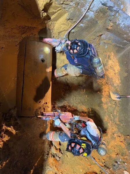 Rescuers dig up entire road to save dog stuck in storm drain Rescuers dig up entire road to save dog stuck in storm drain
