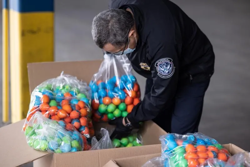 CBP Advises Traveling Public on Easter Egg Regulations A CBP agriculture specialist examines cascarones.