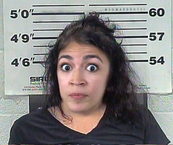 AOC Pretends to be Handcuffed During Arrest at Supreme Court Protest AOC Pretends to be Handcuffed During Arrest at Supreme Court Protest