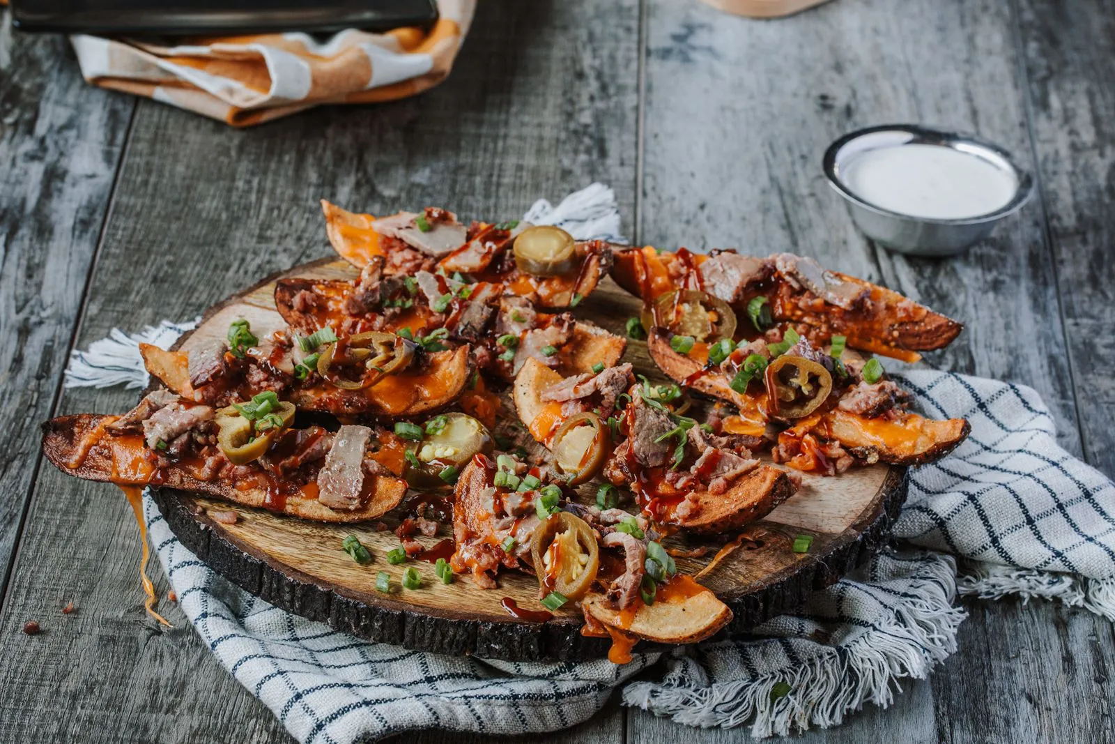 Logan's Roadhouse Loaded Potato Skins Logan's Roadhouse Debuts Menu Revamp Starring Cinnamon Rolls and Two All-New Desserts